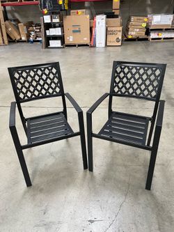 Pair of black steel patio chairs