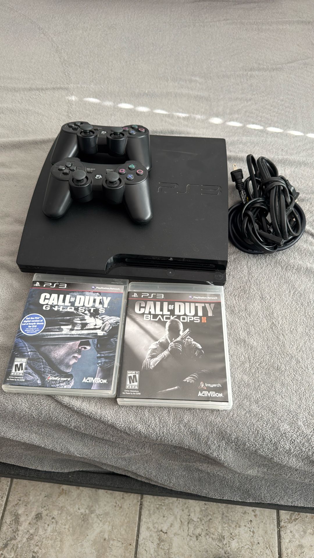 PlayStation 3 With Games And Controllers