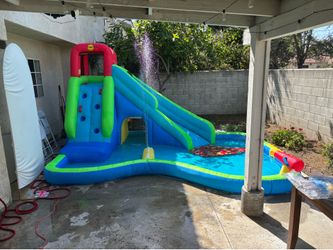 Inflatable water slide with pool
