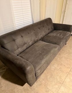 Biscuit-tufted, mid-century modern style sofa
