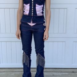 Cowgirl outfit: jeans, silvery pink, and bead tassel