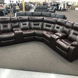 New Reclining Sectional .  Brown Gel Leatherette .  106” X 106”.  Free Delivery !