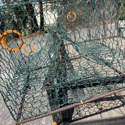 Crab trap, cast net in smaller crab traps