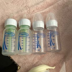 Two Plastic And Two Glass DrBrowns Bottles