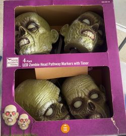 4 pack LED zombie heads pathway lights with timer