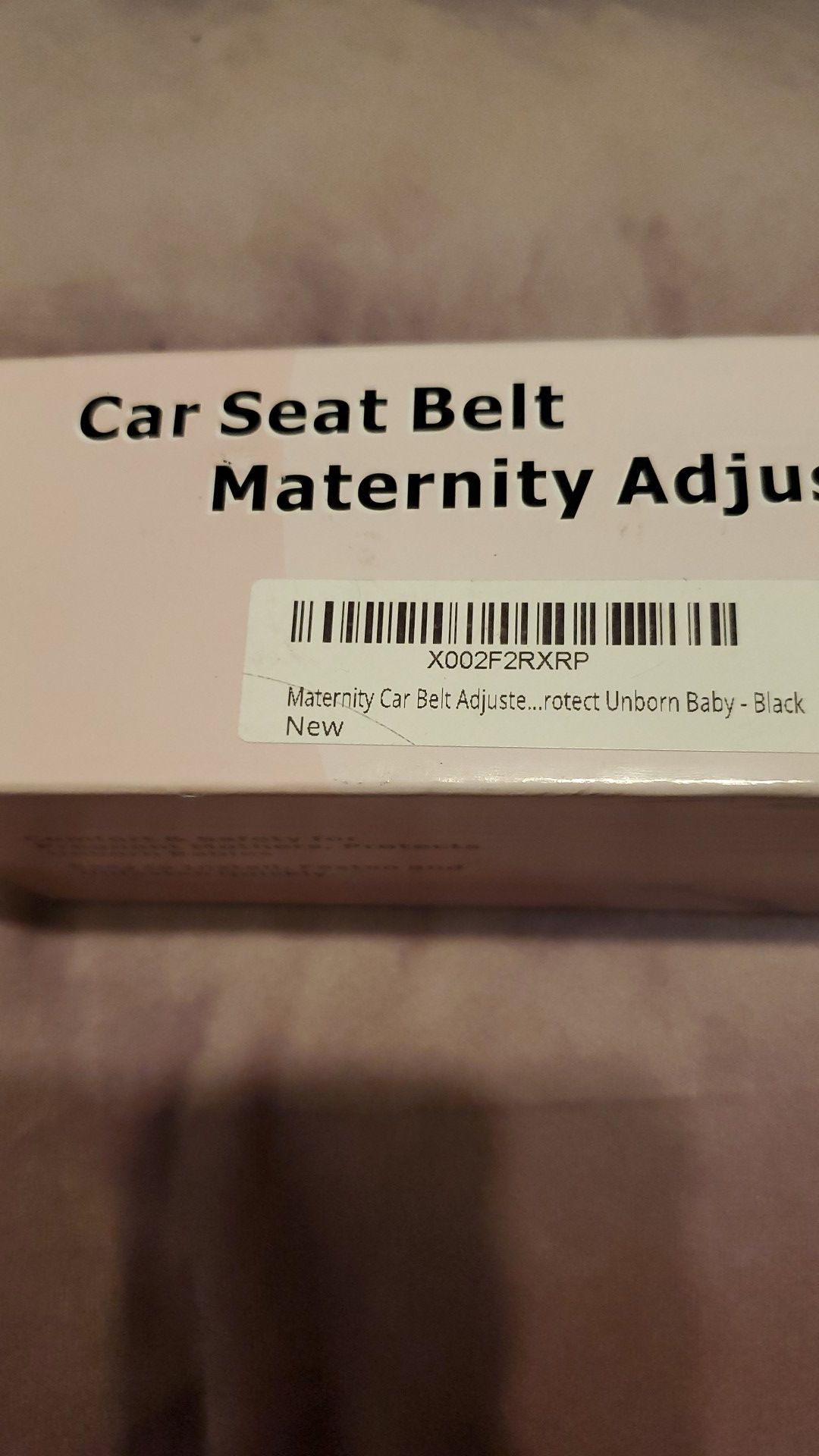 Maternity car seat belt adjuster
