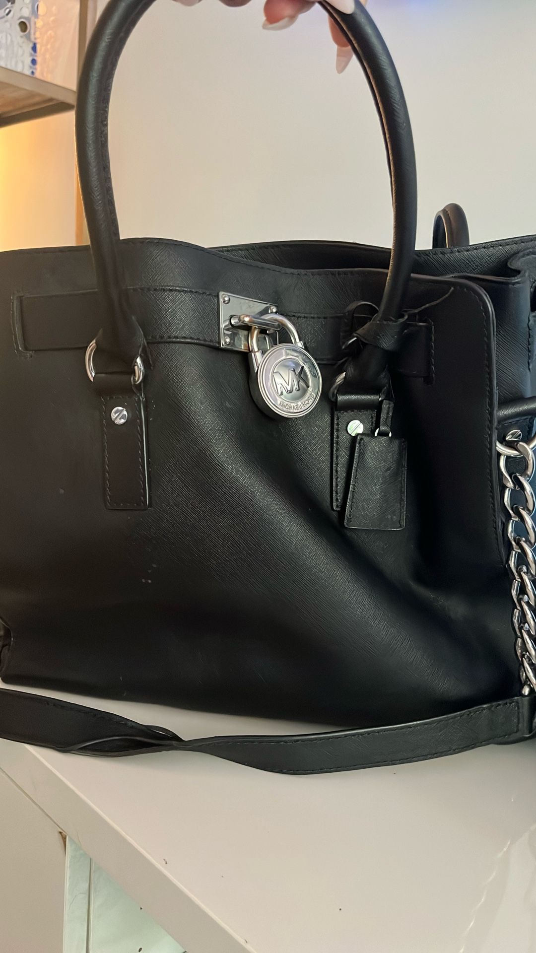 Used 100% Leather Black Michael Kors Bag With Silver Accents.