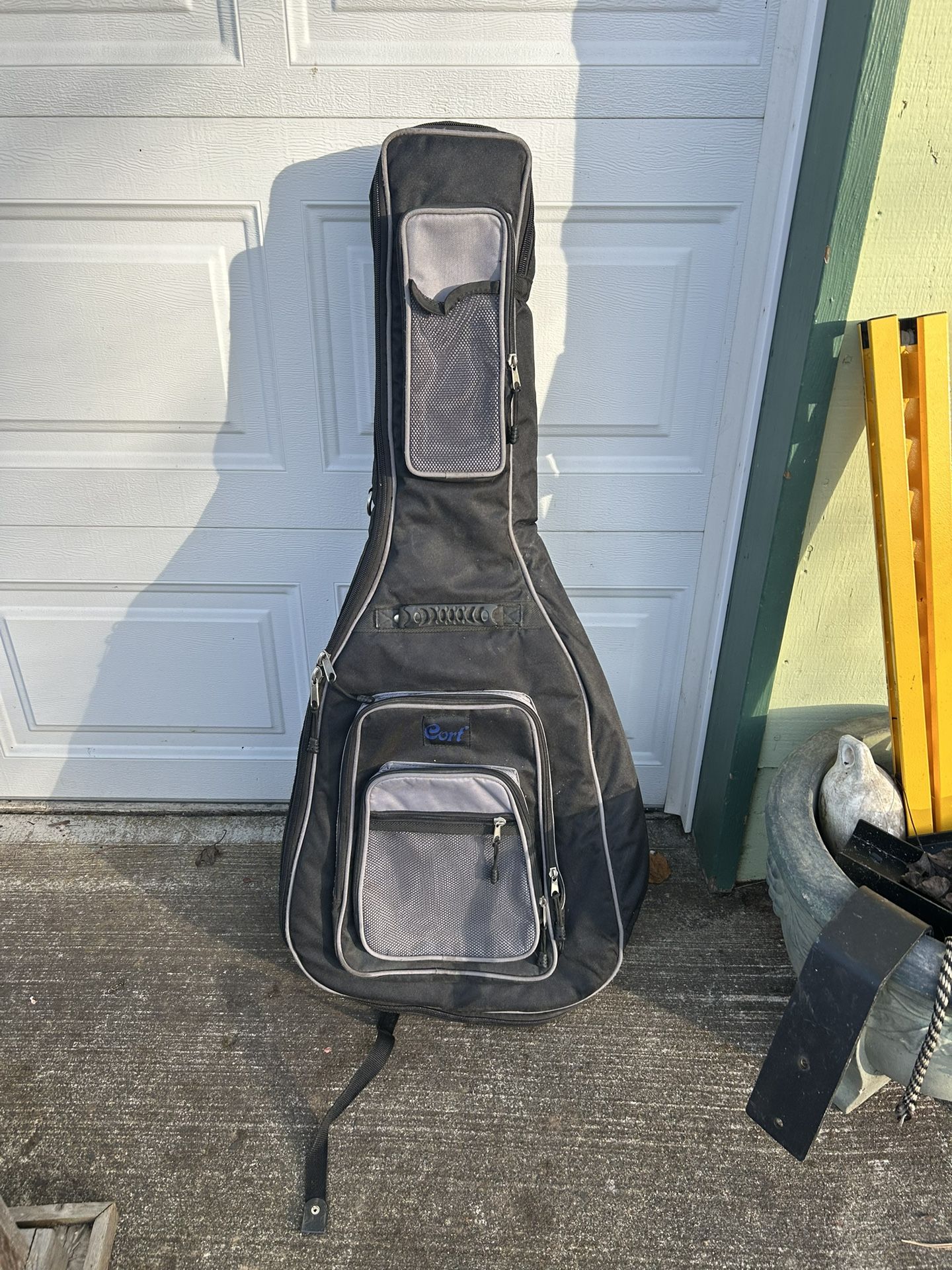 Acoustic guitar pad a gig bag in good shape. Has backpack straps and all the zippers work just fine.   $40, cash or Venmo, meet in person somewhere co