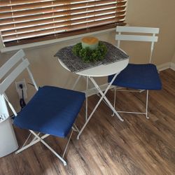 Two Chairs And Small Round table 