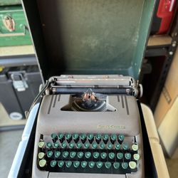 1952  Smith Corona Sterling portable typewriter with carrying case