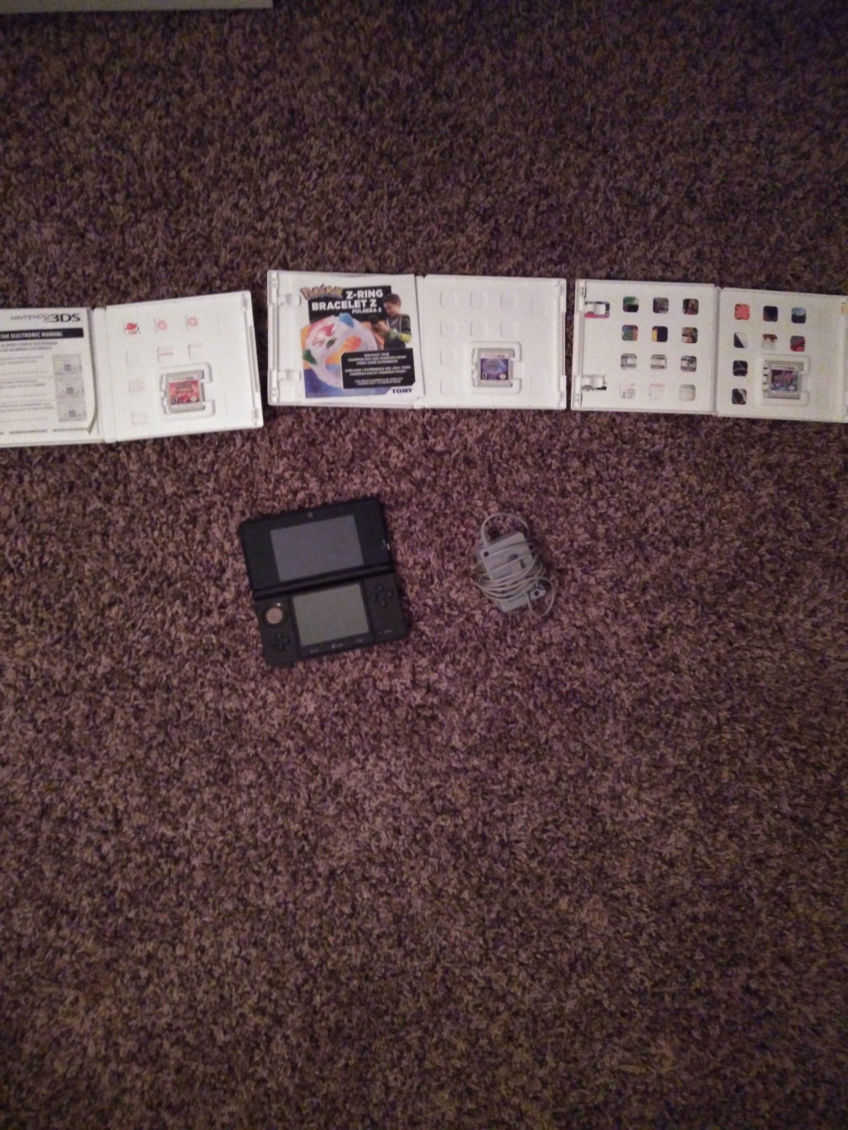 3DS with charger and 3 Pokemon games