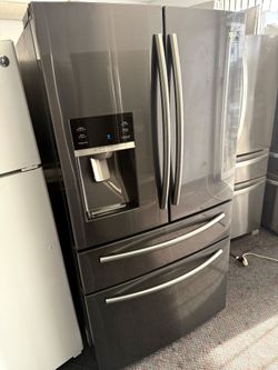 Samsung black stainless stainless French door refrigerator and bottom freezer
