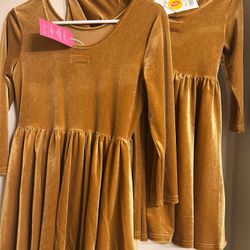 Both Dresses are new! Size 14 & 7 Price $1 And Up!