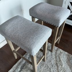 2 Subrtex 24" Backless Bar Stools - Set of 2 Lightly used bar stools with gray upholstered cushions