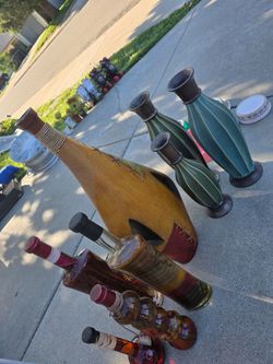 Decorative ceramic and glass bottles with peppers