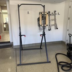 Adjustable folding pull up and dip bar