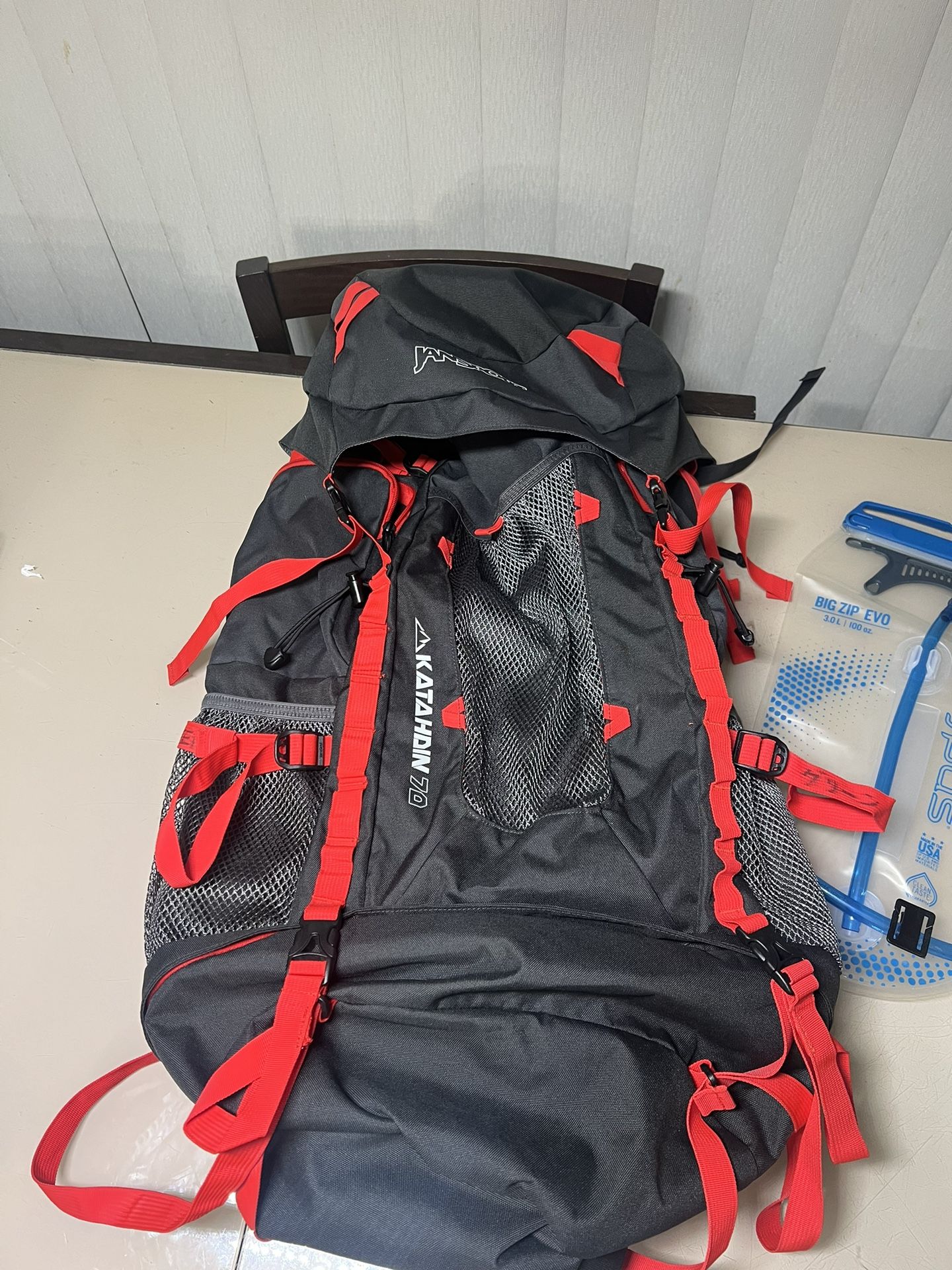 JanSport Katahdin 70L Hiking Camping Outdoors Backpack & Platypus Big Zip Evo 3.0 L. Very gently used in very good condition with minor cosmetic blemi