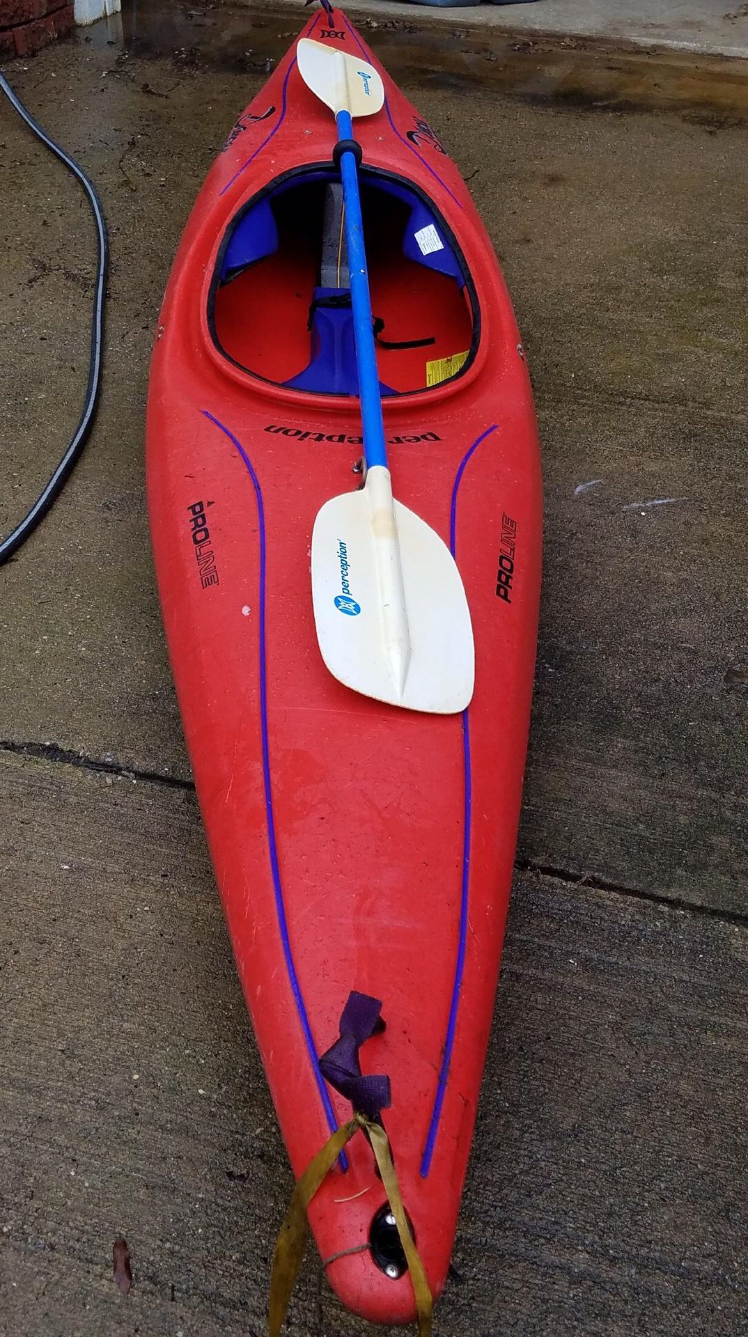 Perception Dancer Proline kayak with perception two piece paddle.