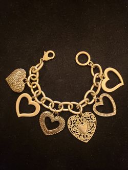 $10. Goldtone heart charm bracelet. 8 inches.