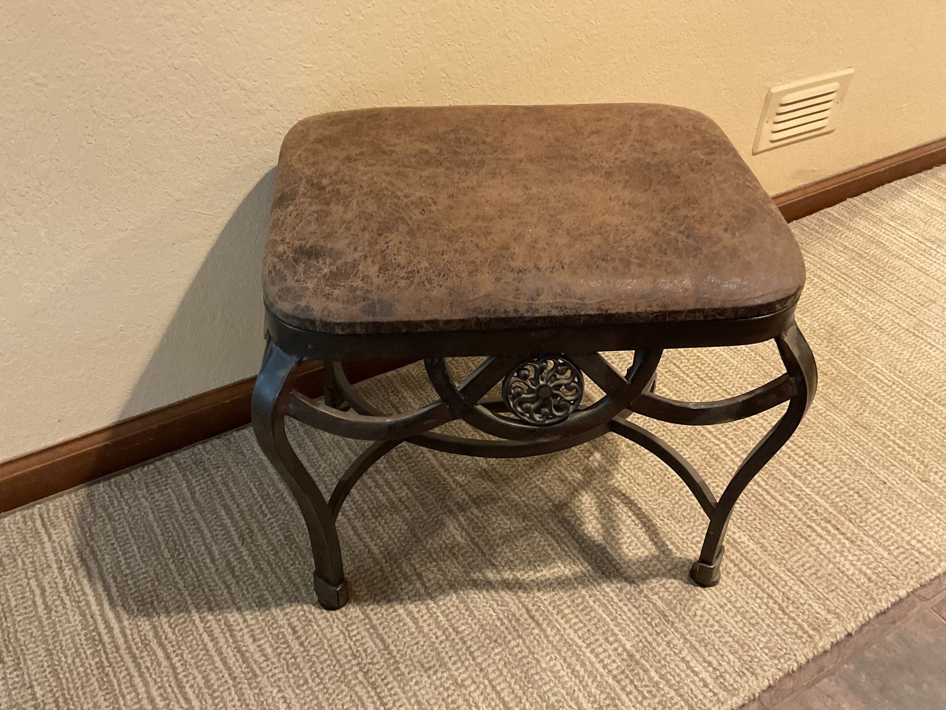 This brown footstool measures 18 inches in width, 15 inches in depth, and 17 inches in height