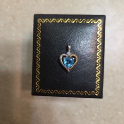 10 K Gold And Sterling Silver Pendant.  Weight Is 1.4 Grams 