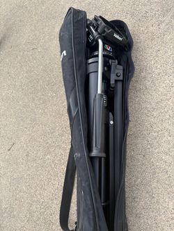 Velbon heavy-duty video camera tripod with adjustable pan/tilt head and original carrying case.