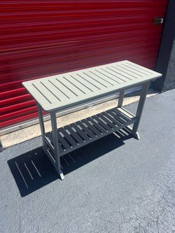 Ikea 2-tier slatted wooden console table designed for both indoor and outdoor use.