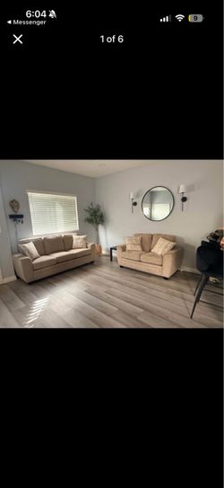 Tan sofa and loveseat set