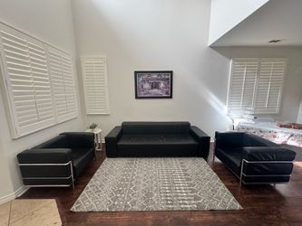 Real leather black couch and two matching chairs