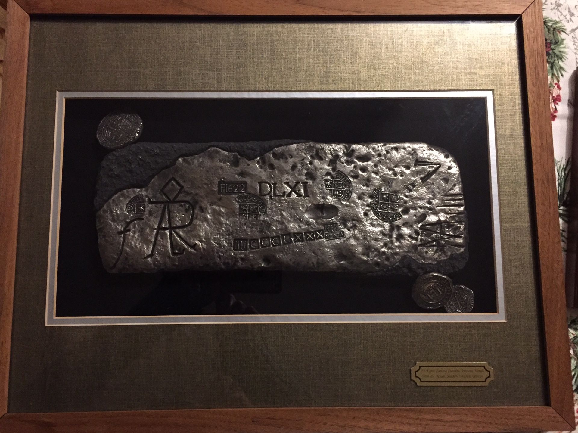 Reproduction of silver bar and coins made from precious metals from the Atocha