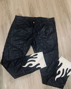 Black leather pants with white flames on the bottom