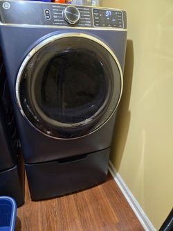 GE Dryer on matching pedestal.