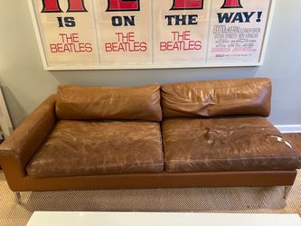 Half of an L shaped  leather couch.