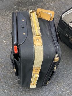 Vintage Black Rolling Suitcase with Tan Strap