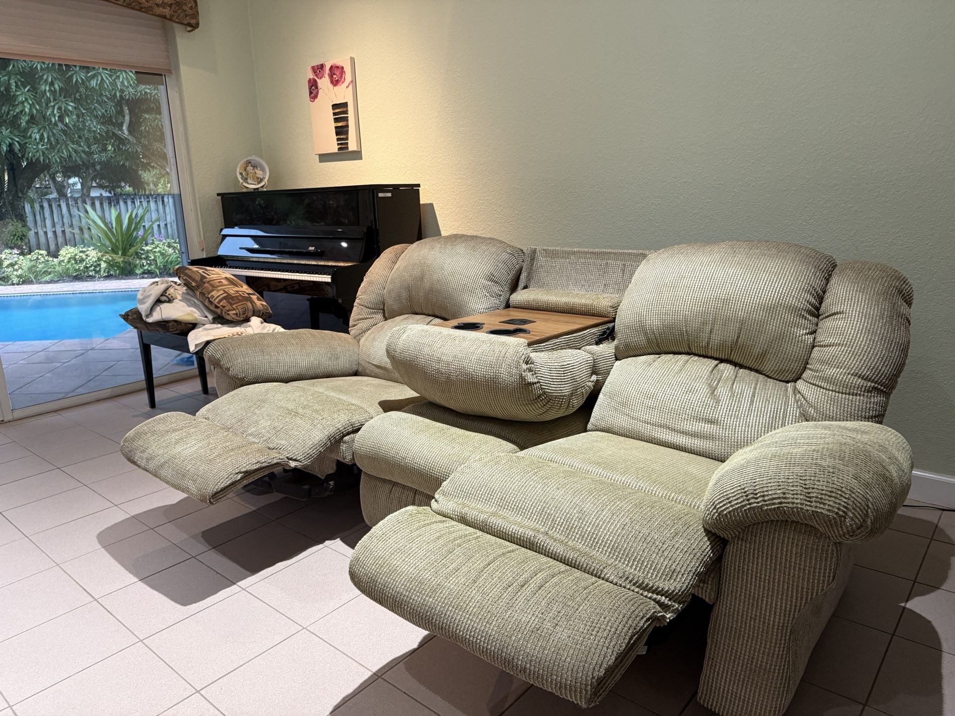 recline-able sofa with massage setting and cup holders