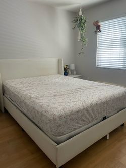 Bed Set: cream headboard, frame, mattress, two glass lamps and nightstands