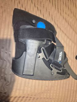 United Ortho Short Air Cam Walker Fracture Boot. It features an integrated air bladder system that is inflated using the blue bulb to adjust compressi