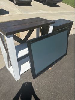 FREE TV. Cabinet. And wood shelves.