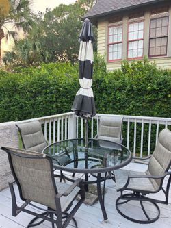 Patio Dining Set – Glass Table with 4 Swivel Sling Chairs – Excellent Condition