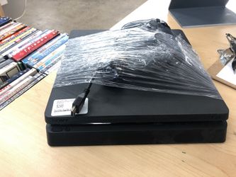 PS4 with cords and remote