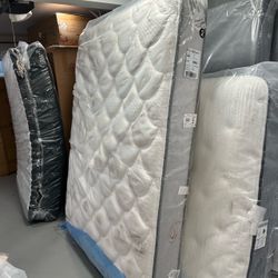 White Quilted Mattress Still in Plastic Wrap