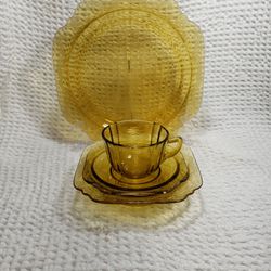 Madrid Federal glass  amber depression glass 1 placing set plate 10 1/4"  , bowl 6 3/4" ,saucer 5 3/4" and cup 2 1_2" T X 3 1/2" W . Good condition an
