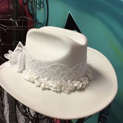 White western-style hat can be used for bridal or bachelorette events, styled with custom lace trim and floral acce