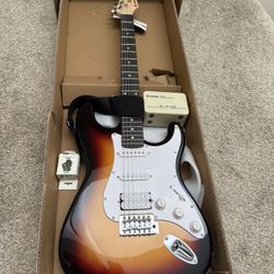 NEW Donner DST-100S Electric Guitar with Amp!! Has chip on back from shipping- see pic