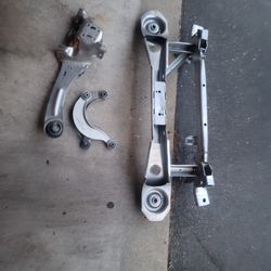 OEM rear subframe + suspension arms.