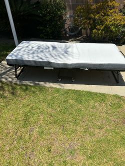 Twin size folding/rollaway bed