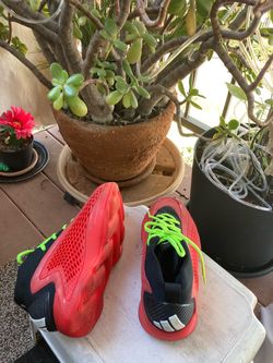 Red and Black Sneakers with Neon Laces