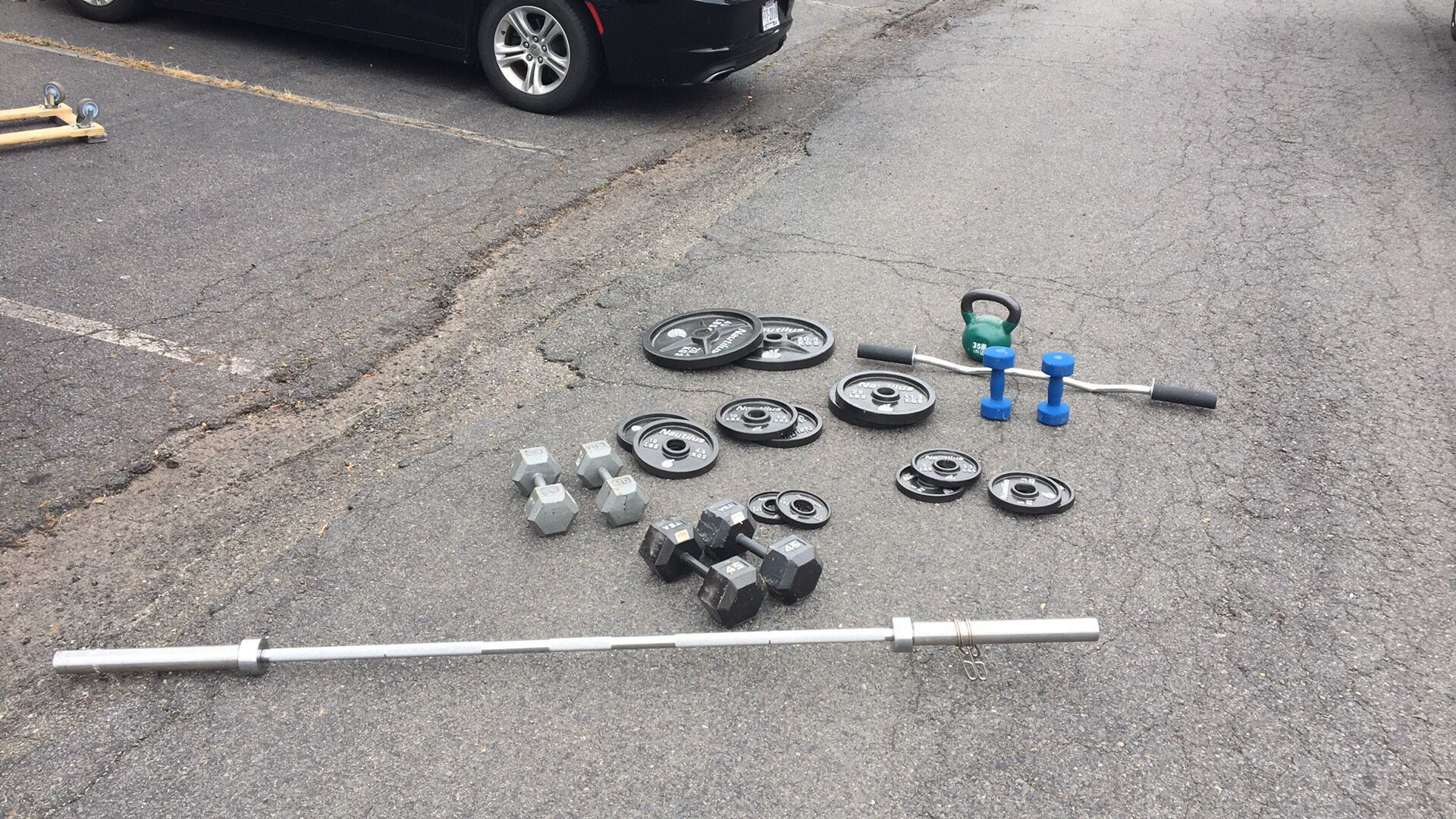 Weights, weight plates, kettlebell and Olympic bar