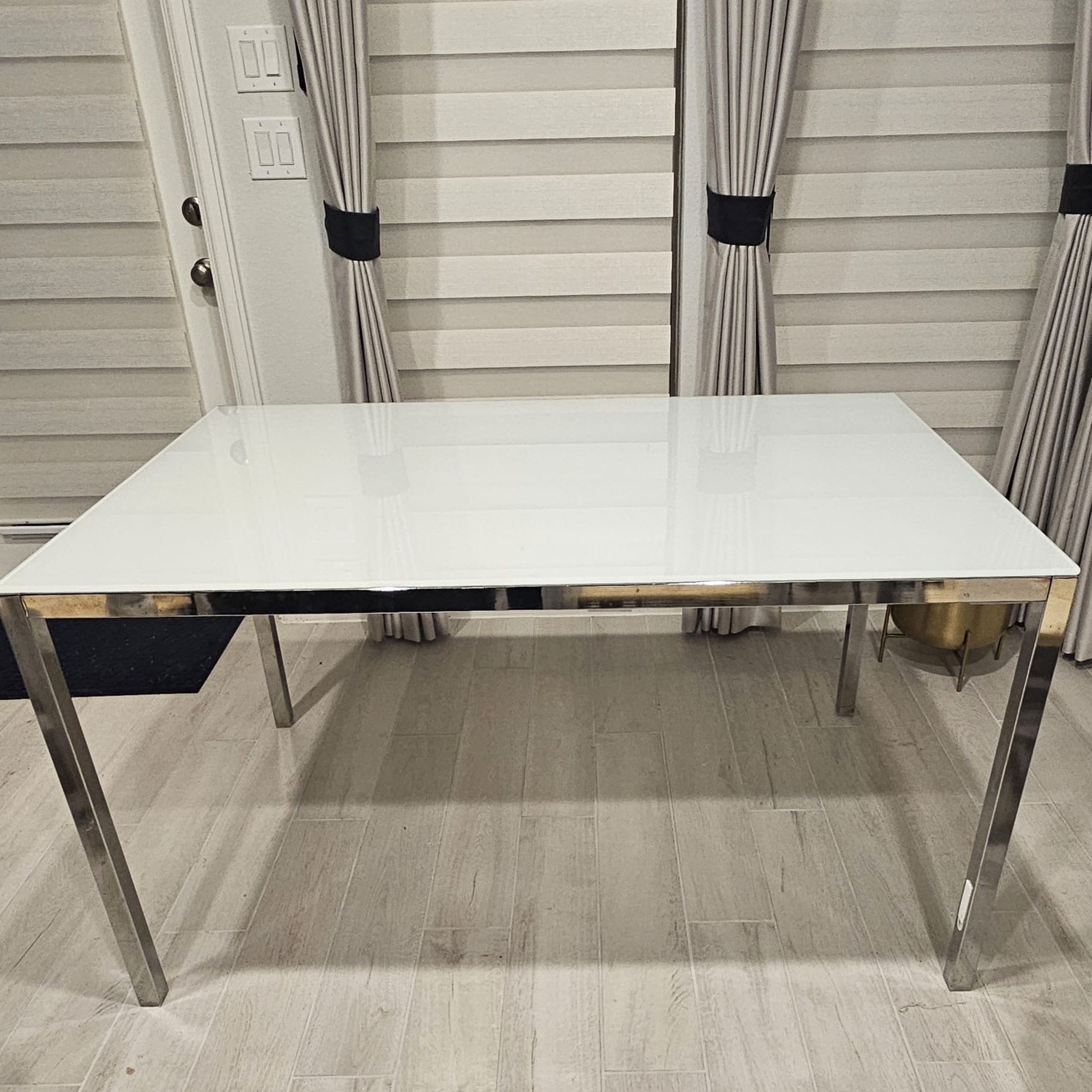 Beautiful Ikea Torsby White Glass top Dining table with chrome legs 