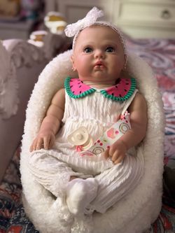 Reborn open eyes pickle doll made from a kit